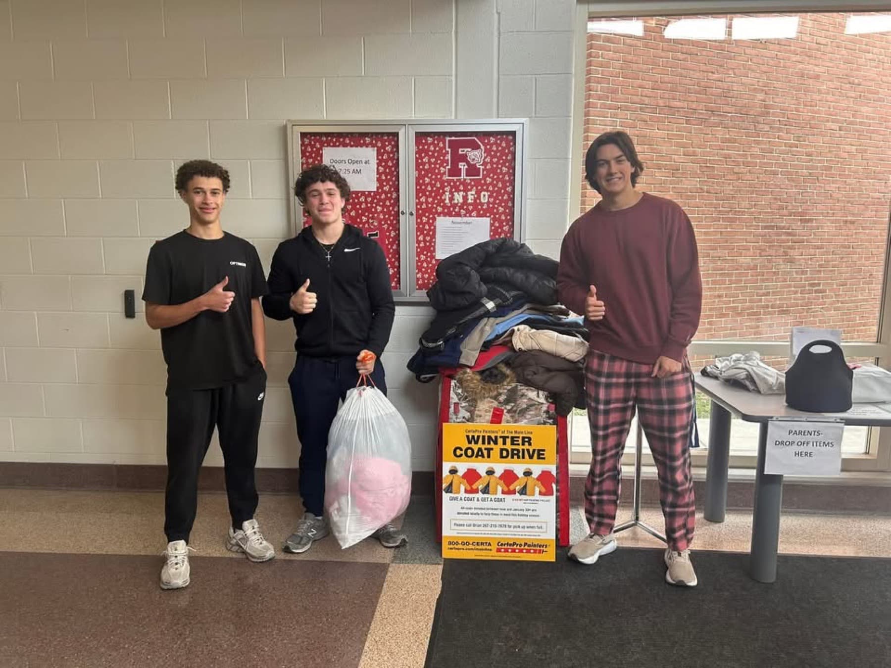 Iconic Landscaping coat drive team